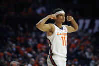 Illinois' Alfonso Plummer (11) flexes after a play during the first half of an NCAA college basketball game against Texas Rio Grande Valley Friday, Nov. 26, 2021, in Champaign, Ill. (AP Photo/Michael Allio)