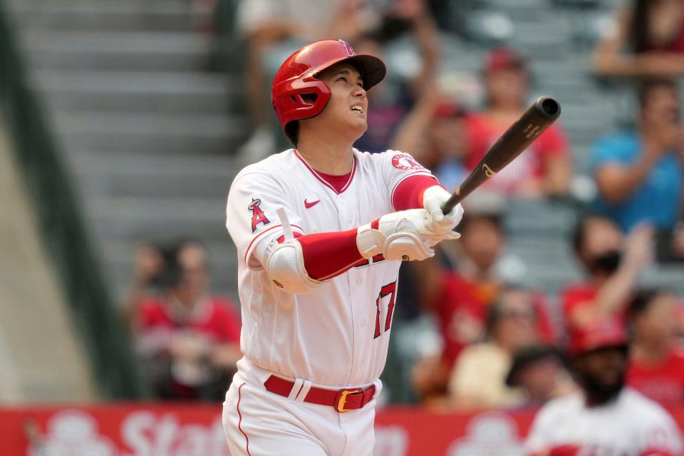 Angels designated hitter Shohei Ohtani follows through on a solo home run in the seventh inning of the Tigers'  5-4 win on Wednesday, Sept.  7, 2022, in Anaheim, California.