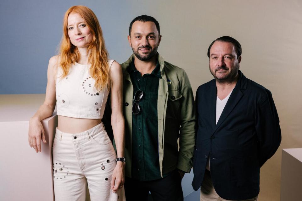 A producer, director and actor pose at The Toronto Film Festival.