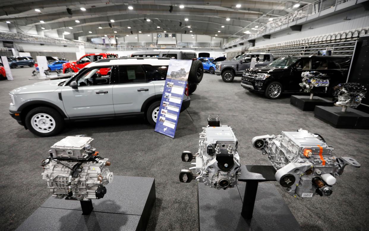 Electric vehicle motors during setup for the first Springfield Auto Show at the Wilson Logistics Arena at the Ozark Empire Fairgrounds on Thursday, Nov. 2, 2023.