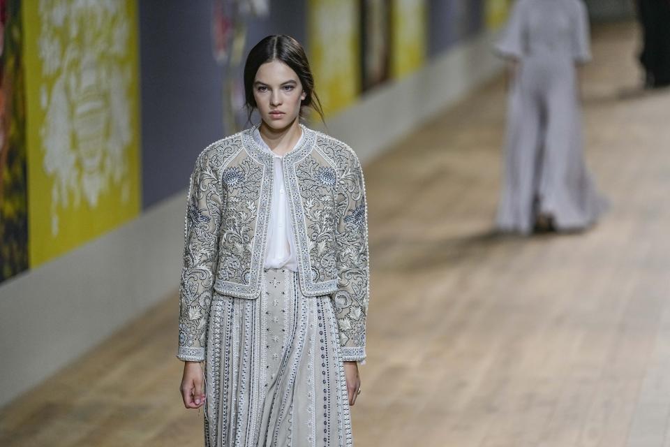 A model wears a creation as part of Dior's Haute Couture Fall/Winter 2022-2023 fashion collection presented Monday, July 4, 2022 in Paris. (AP Photo/Michel Euler)