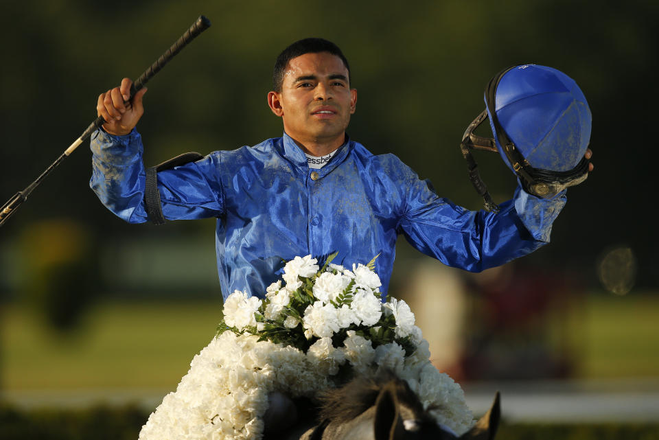 Jockey Luis Saez reacts after winning the 153rd running of the Belmont Stakes horse race with Essential Quality (2), Saturday, June 5, 2021, At Belmont Park in Elmont, N.Y. (AP Photo/Eduardo Munoz Alvarez)