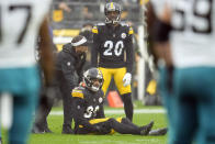 Pittsburgh Steelers safety Minkah Fitzpatrick (39) is helped by a trainer after getting injured against the Jacksonville Jaguars during the first half of an NFL football game Sunday, Oct. 29, 2023, in Pittsburgh. (AP Photo/Gene J. Puskar)