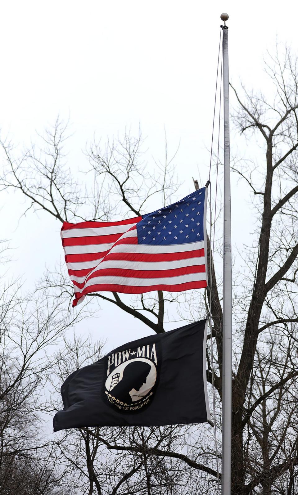 The United States flag flies at half-staff at Gahanna Veterans Memorial in Gahanna on Tuesday, January 12, 2021.