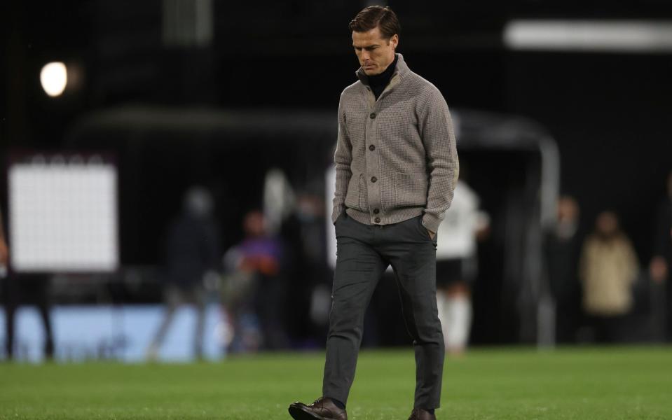 Fulham's manager Scott Parker trudges off at the end, with the team relegated - Pool via AP