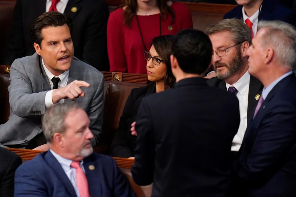 Rep. Matt Gaetz, R-Fla., talks to Rep. Kevin McCarthy, R-Calif., after Gaetz voted "present" in the House chamber as the House meets for the fourth day to elect a speaker and convene the 118th Congress in Washington, Friday, Jan. 6, 2023.