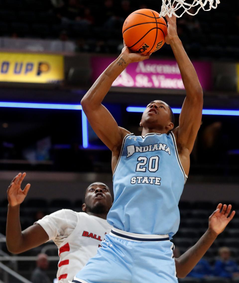 Indiana State Sycamores guard Jayson Kent (20) shoots the ball during the NCAA men’s basketball game against the Ball State Cardinals, Saturday, Dec. 16, 2023, at Gainbridge Fieldhouse in Indianapolis.