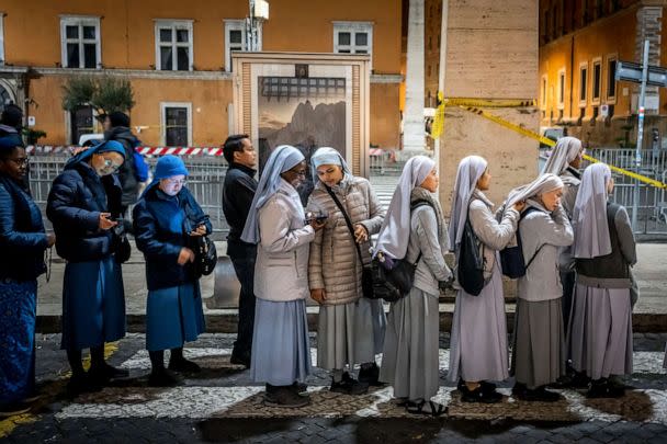 PHOTO: Nuns queue before dawn to view the body of Pope Emeritus Benedict XVI as it lies in state in St. Peter's Basilica at the Vatican, Jan. 3, 2023. (Ben Curtis/AP)