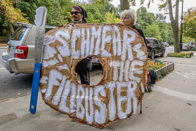 Anti-filibuster activists pressure Senate Majority Leader Chuck Schumer (D-N.Y.) to change the Senate rule at a protest in New York City. (Photo: Erik McGregor via Getty Images)