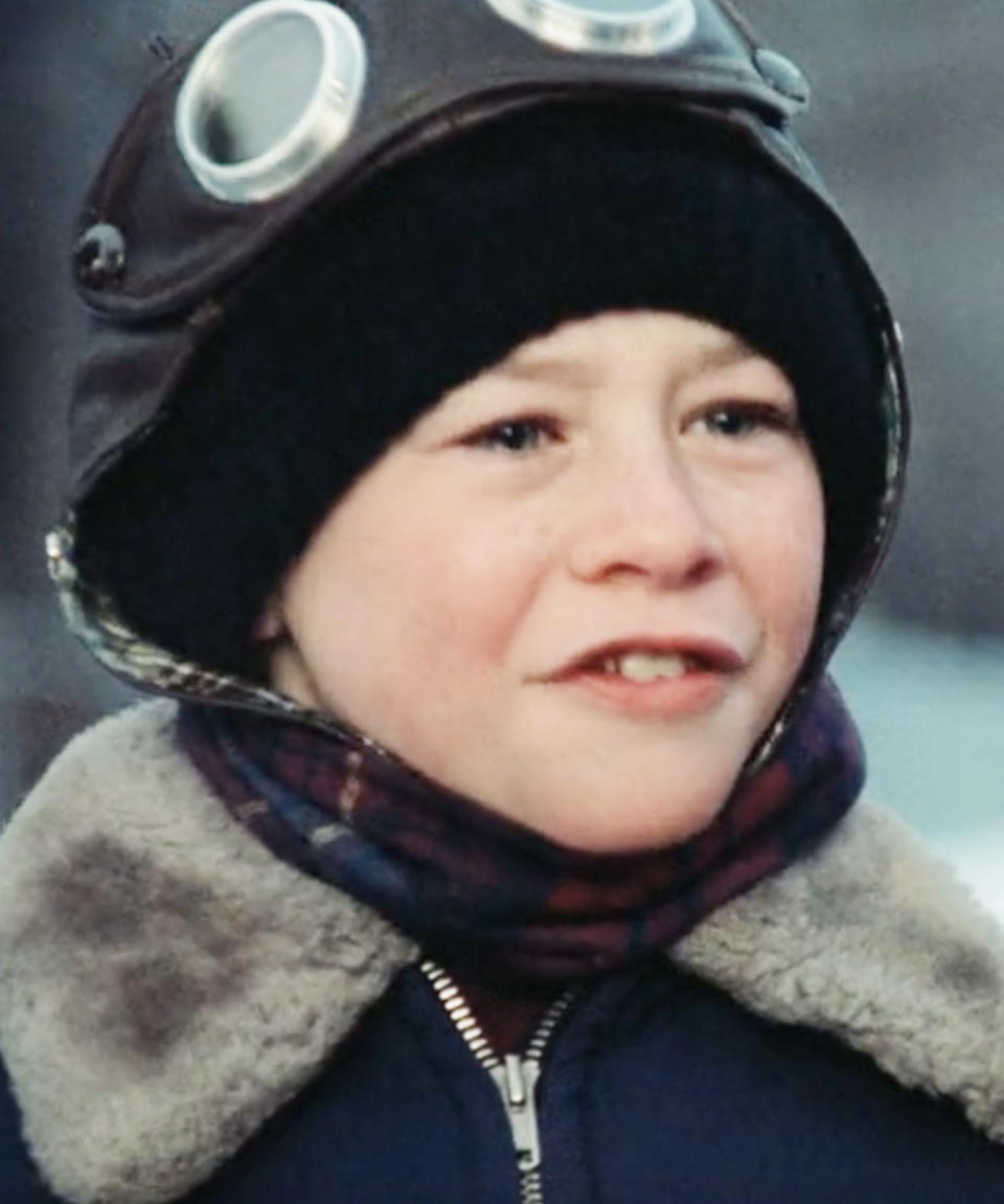 Close-up of Scott in a hat, scarf, and coat