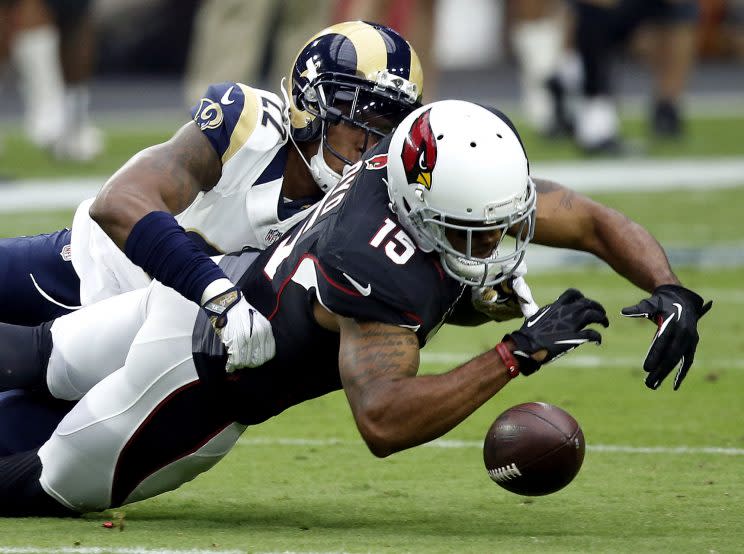 A pass to Michael Floyd gets broken up against the Rams (AP)