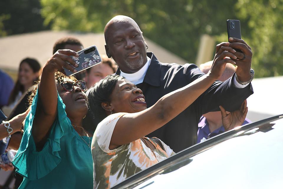Michael Jordan takes a few photos with friends outside of The Michael Jordan Family Medical Clinic led by Novant Health. After taking part in a ribbon cutting ceremony for the new clinic opening off of Greenfield Street Tuesday May 7, 2024 in Wilmington, N.C. KEN BLEVINS/STARNEWS