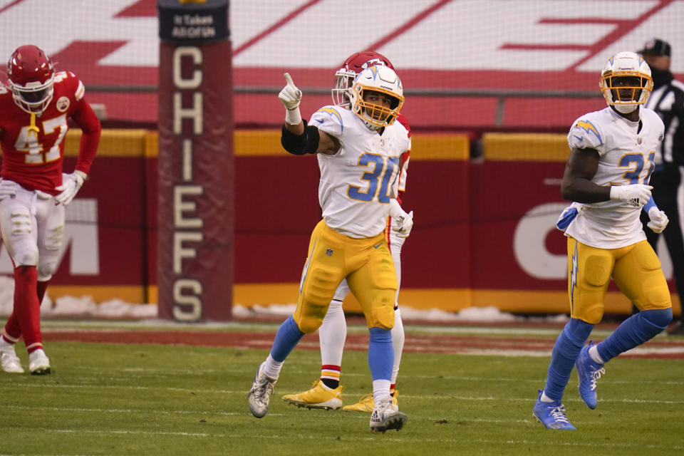 Los Angeles Chargers running back Austin Ekeler (30) celebrates after catching a 4-yard touchdown pass during the first half of an NFL football game against the Kansas City Chiefs, Sunday, Jan. 3, 2021, in Kansas City. (AP Photo/Jeff Roberson)