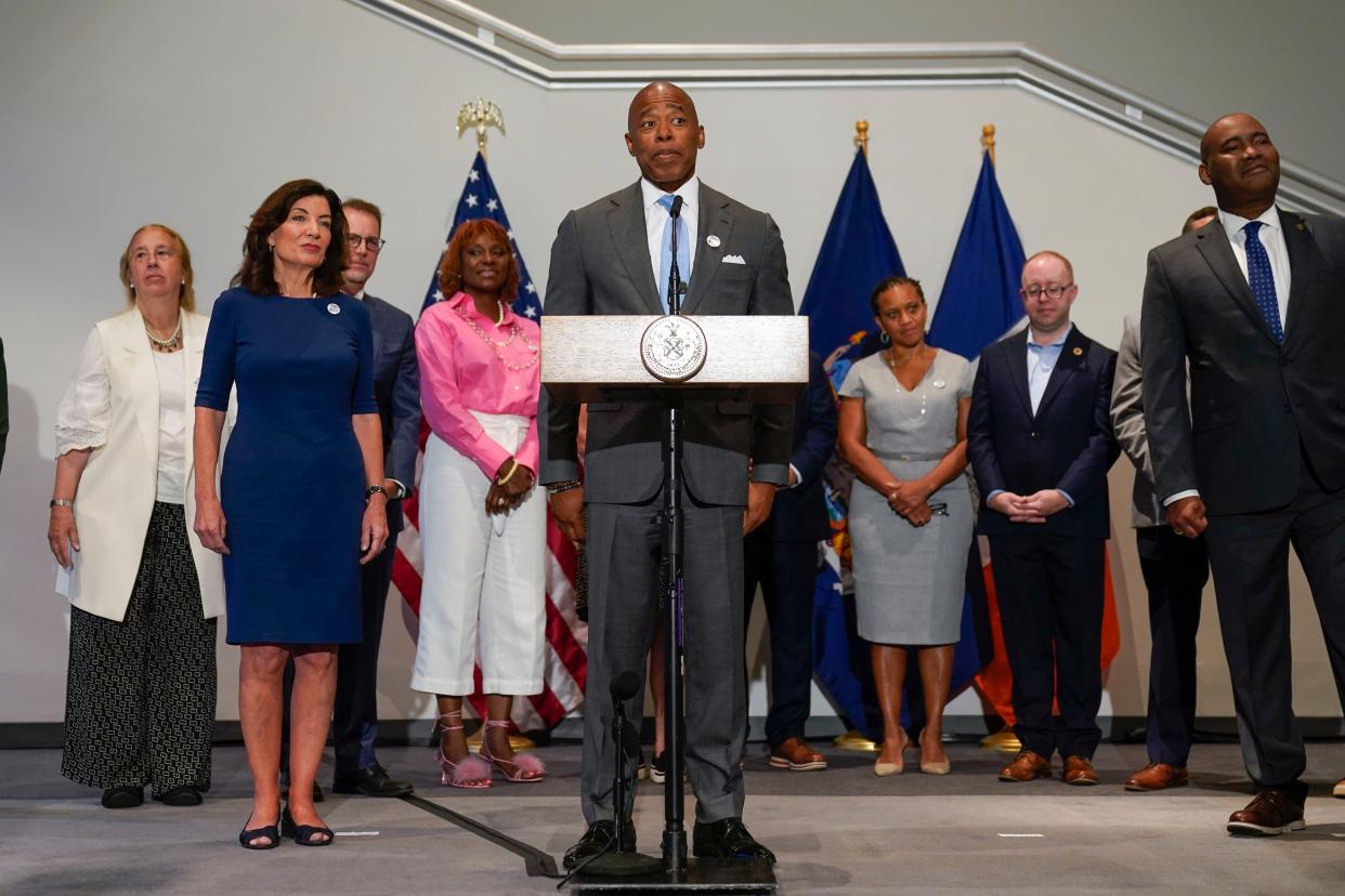 New York Gov. Kathy Hochul (left) and New York City Mayor Eric Adams (center) at a news conference in Manhattan, New York on Thursday, July 21, 2022. 