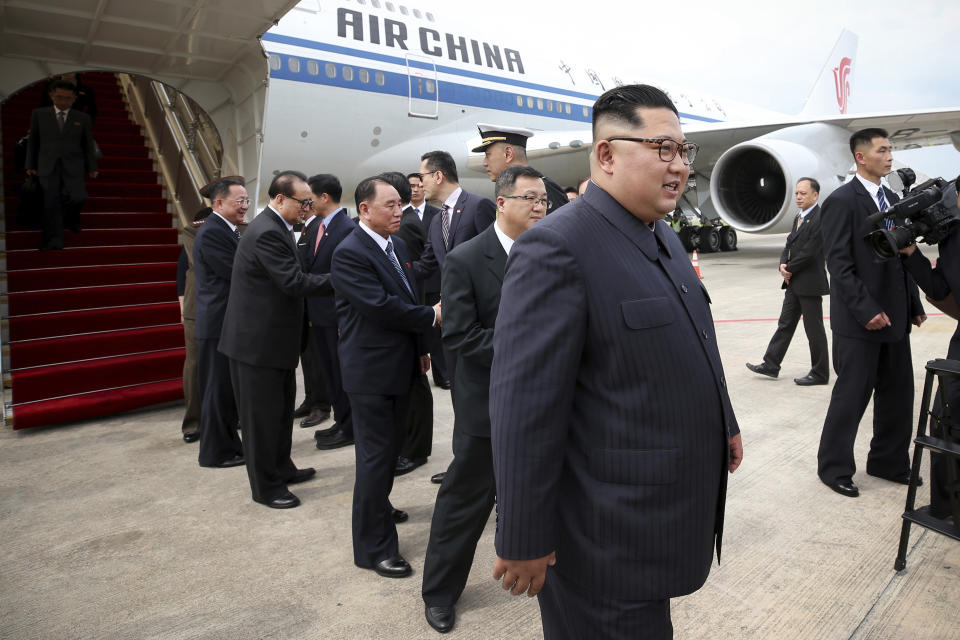 <p>North Korean leader Kim Jong Un, right, arrives at the Changi International Airport, Sunday, June 10, 2018, in Singapore ahead of a summit with U.S. President Donald Trump. (Photo: Ministry of Communications and Information of Singapore via AP) </p>