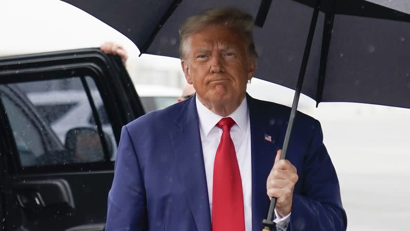 Former President Donald Trump walks over to speak with reporters before he boards his plane at Ronald Reagan Washington National Airport, Thursday, Aug. 3, 2023, in Arlington, Va., after facing a judge on federal conspiracy charges that allege he conspired to subvert the 2020 election.