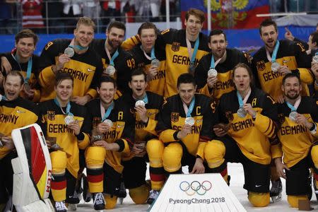 Ice Hockey - Pyeongchang 2018 Winter Olympics - Men Final Match - Olympic Athletes from Russia v Germany - Gangneung Hockey Centre, Gangneung, South Korea - February 25, 2018 - German team players pose with their silver medals. REUTERS/Grigory Dukor