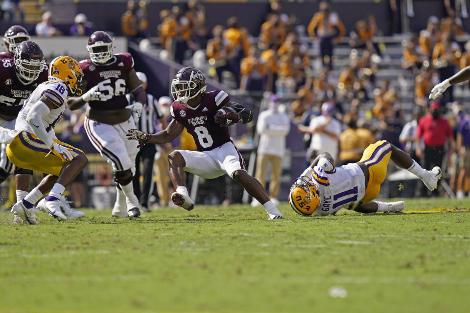 Mississippi State running back Kylin Hill (8) carries against LSU linebacker Damone Clark (18) and defensive lineman Ali Gaye (11)in the first half an NCAA college football game in Baton Rouge, La., Saturday, Sept. 26, 2020. (AP Photo/Gerald Herbert)