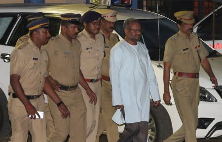 Bishop Franco Mulakkal (2nd R), accused of raping a nun, is escorted by police outside a crime branch office on the outskirts of Kochi in the southern state of Kerala, India, September 21, 2018. REUTERS/Sivaram V