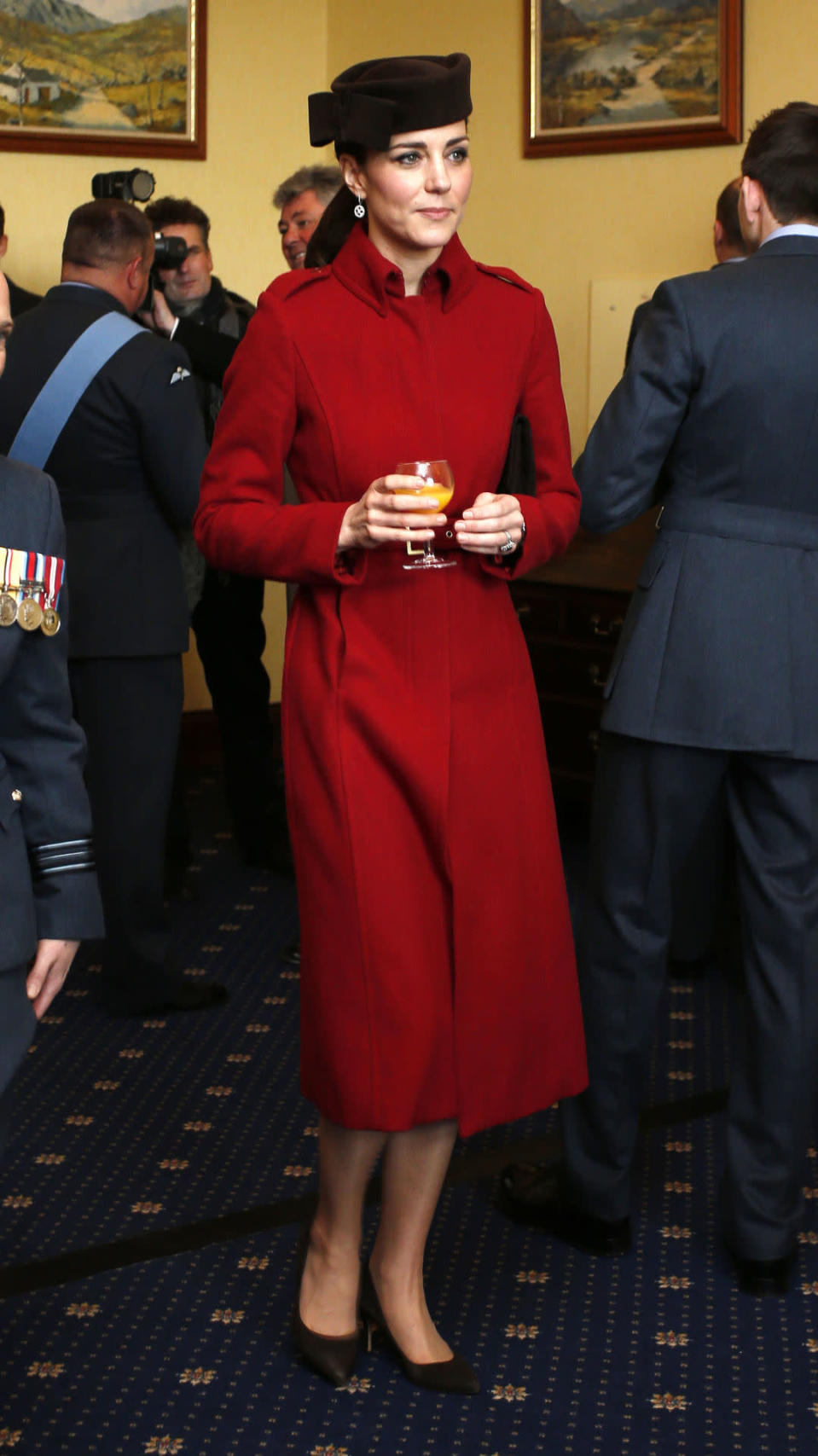 <p>Kate’s RAF trip to Wales featured a fitted red coat by favoured retailer L.K. Bennett and a chic black hat designed by Lock & Co Hatters.</p><p><i>[Photo: PA]</i></p>