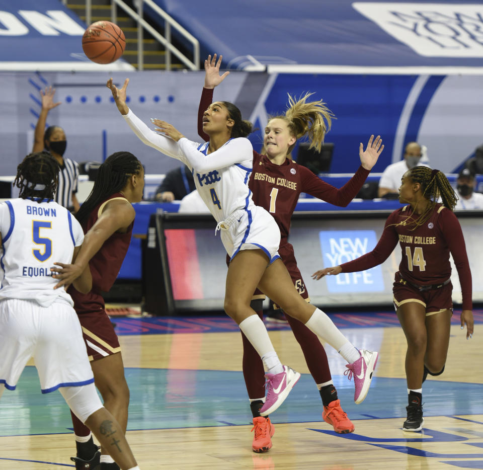 Pittsburgh Emy Hayford (4) drives the lane for a shot under pressure from Boston College's Cameron Swartz in the opening round of the Atlantic Coast Conference Tournament, Wednesday, March 3, 2021, at the Greensboro Coliseum in Greensboro, N.C. (Walt Unks/The Winston-Salem Journal via AP)