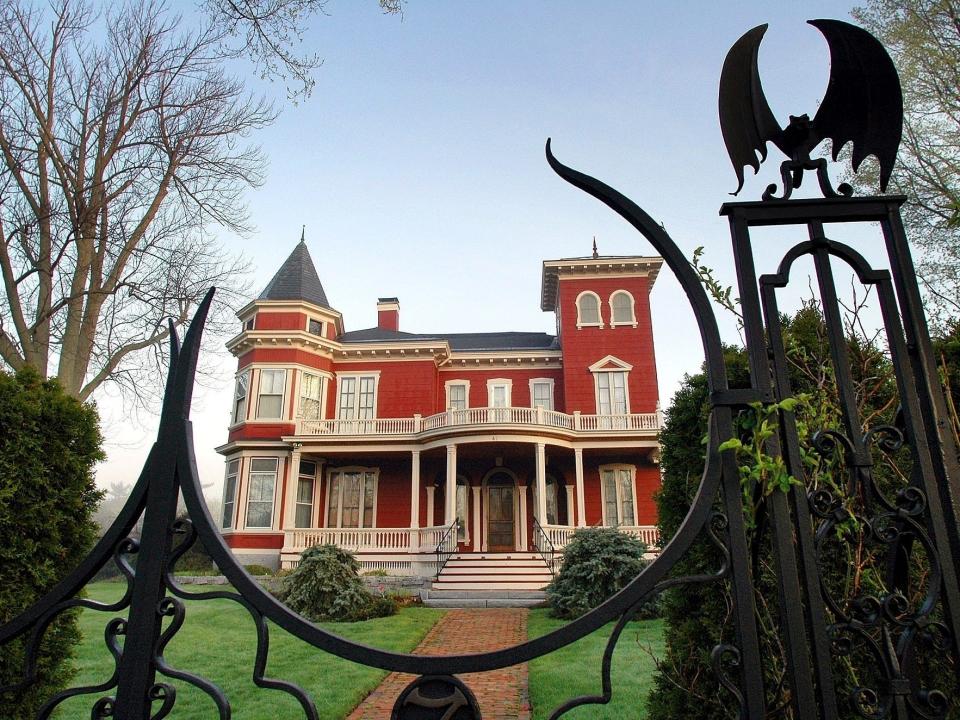 FILE - This May 16, 2005, file photo shows the home of authors Stephen and Tabitha King in Bangor, Maine. The writers have petitioned the city of Bangor for a zoning change for the home where they raised their children. If approved, the mansion will become home to Stephen King’s archives, and a guest house next door will become home to writers in residence. (AP Photo/Robert F. Bukaty, File)