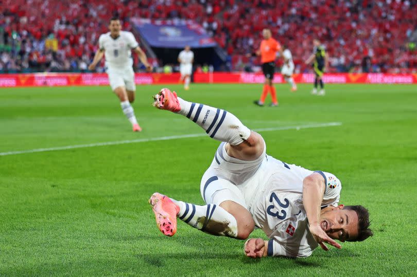 Xherdan Shaqiri celebrates his goal for Switzerland against Scotland, scoring past former Stoke keeper Angus Gunn.