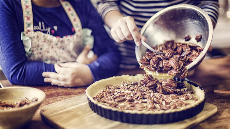 girls preparing homemade pecan pie