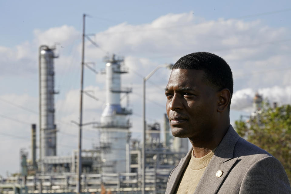 FILE - EPA Administrator Michael Regan stands near the Marathon Petroleum Refinery as he conducts a television interview, while touring neighborhoods that abut the refinery, in Reserve, La., Nov. 16, 2021. The Biden administration is granting Louisiana's request to administer its own permit program for wells that store carbon dioxide. It will be just the third state to take over that job from the EPA. The EPA said the Louisiana agreement includes safeguards to protect poorer, often majority-Black communities that live near those facilities. Regan said Thursday, Dec. 28, 2023, "It can be done in a way that builds in environmental justice principles that allow for the community to participate in the process and ensures that these communities are safe." (AP Photo/Gerald Herbert)