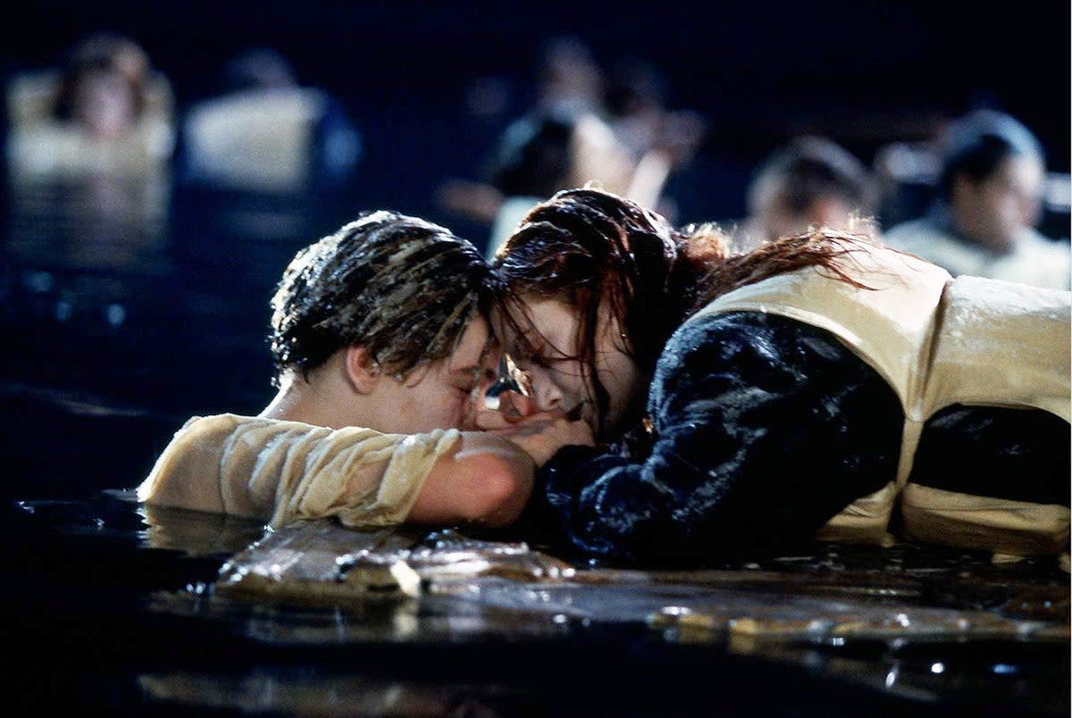 Kate Winslet’s Rose lying on the floating door in ‘Titanic’, while Leonardo Di Caprio’s Jack clings to the side (20th Century Fox/Paramount/Kobal/Shutterstock)