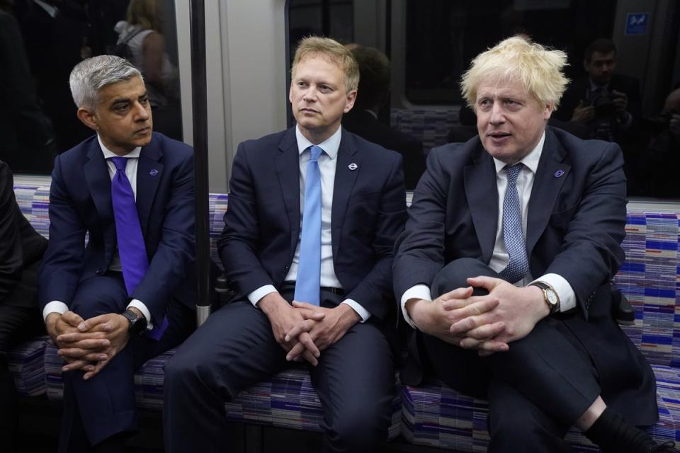 Prime Minister Boris Johnson with Transport Secretary Grant Shapps and Mayor of London Sadiq Khan on a Elizabeth Line train (PA)