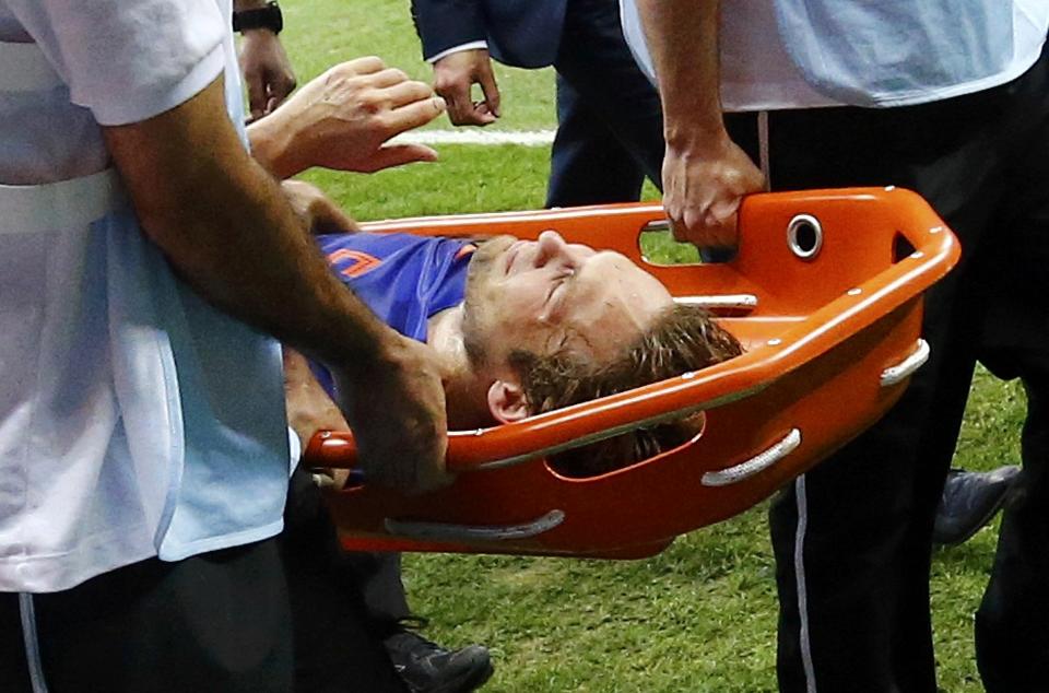 Daley Blind of the Netherlands is carried off the pitch after being injured during their 2014 World Cup third-place playoff against Brazil at the Brasilia national stadium in Brasilia July 12, 2014. REUTERS/Dominic Ebenbichler (BRAZIL - Tags: SOCCER SPORT WORLD CUP)