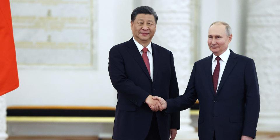 Russian President Vladimir Putin shakes hands with Chinese President Xi Jinping during a welcome ceremony before Russia - China talks in narrow format at the Kremlin in Moscow, Russia March 21, 2023.