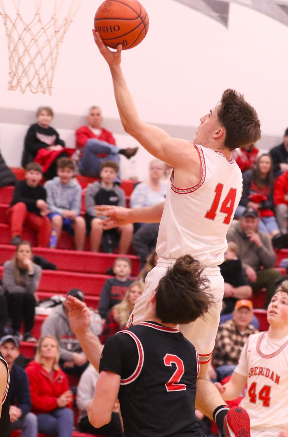 Sheridan's Raine Rodich lays the ball in against Coshocton, as the Generals won 63-35 on Friday night.