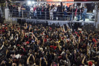 Former Brazilian President Luiz Inacio Lula da Silva, center, who is running for president again, speaks to supporters after general election polls closed in Sao Paulo, Brazil, Sunday, Oct. 2, 2022.(AP Photo/Matias Delacroix)