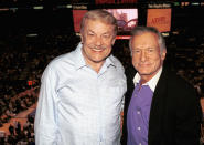 Publisher Hugh Hefner and Lakers owner Jerry Buss pose above the crowd at the Lakers v Nuggets NBA game to celebrate Hefner's 77th birthday April 10, 2003 at the Staples Center, Los Angeles, California. (Photo by David Klein/Getty Images)