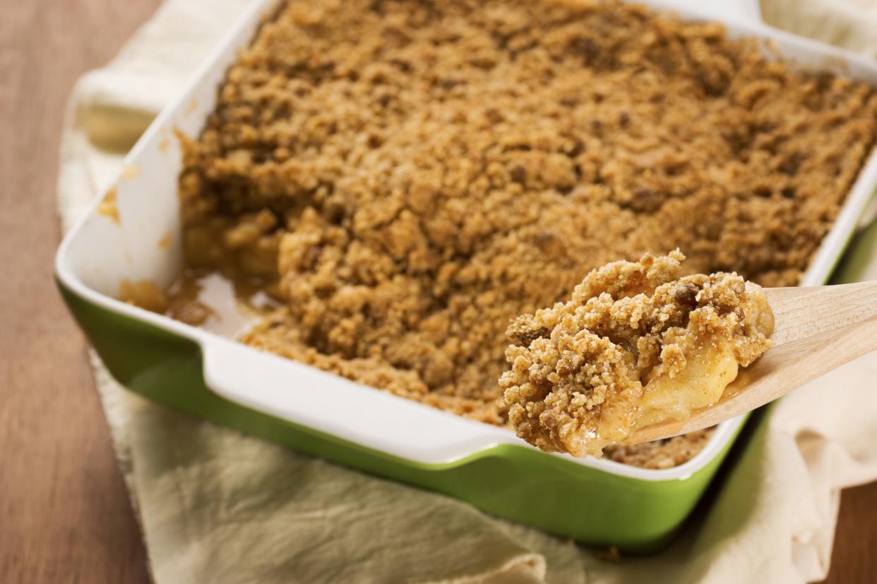 A spoonful of apple crisp (or apple crumble), freshly baked from the oven.