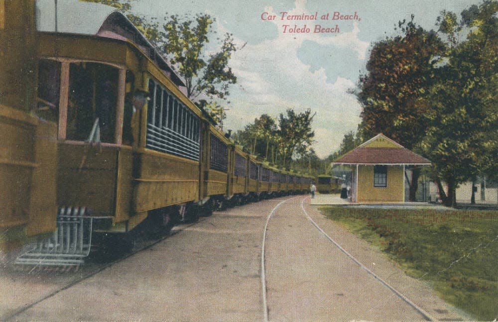 This image shows a postcard of the Toledo, Ottawa Beach and Northern Railway Interurban line, circa 1900.  The railway ran from Summit Street in downtown Toledo through Point Place and along the east side of what is now I-75 into Luna Pier (on present-day Harold Drive) and ended with a turnaround stop at Toledo Beach.