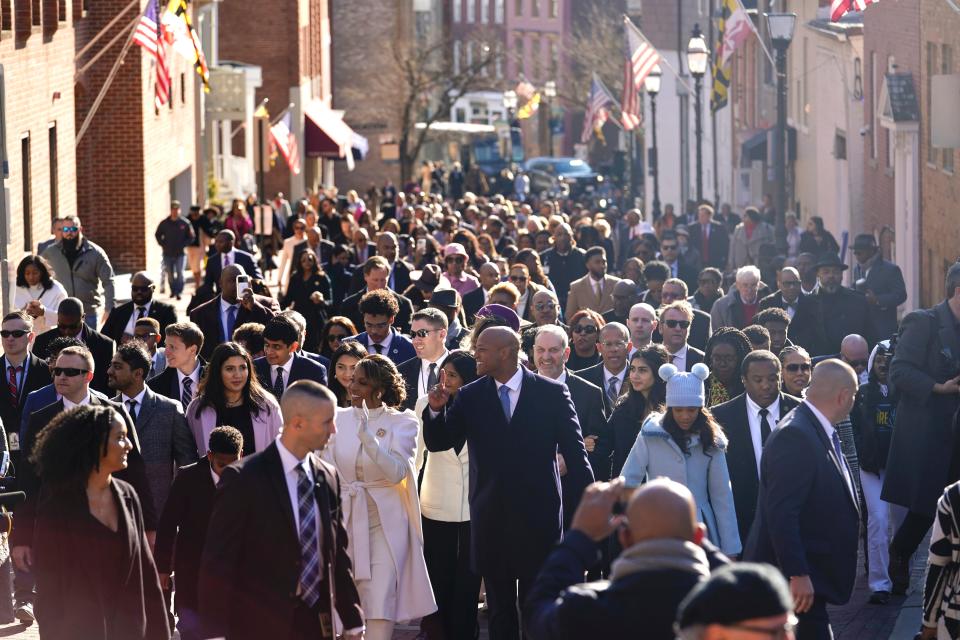 Maryland Gov.-elect Wes Moore, center, leads a march to the State House prior to his inauguration in Annapolis, Md., Wednesday, Jan. 18, 2023. (AP Photo/Bryan Woolston)