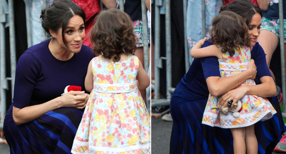 Meghan gives two-year-old Catalina a hug (Getty)