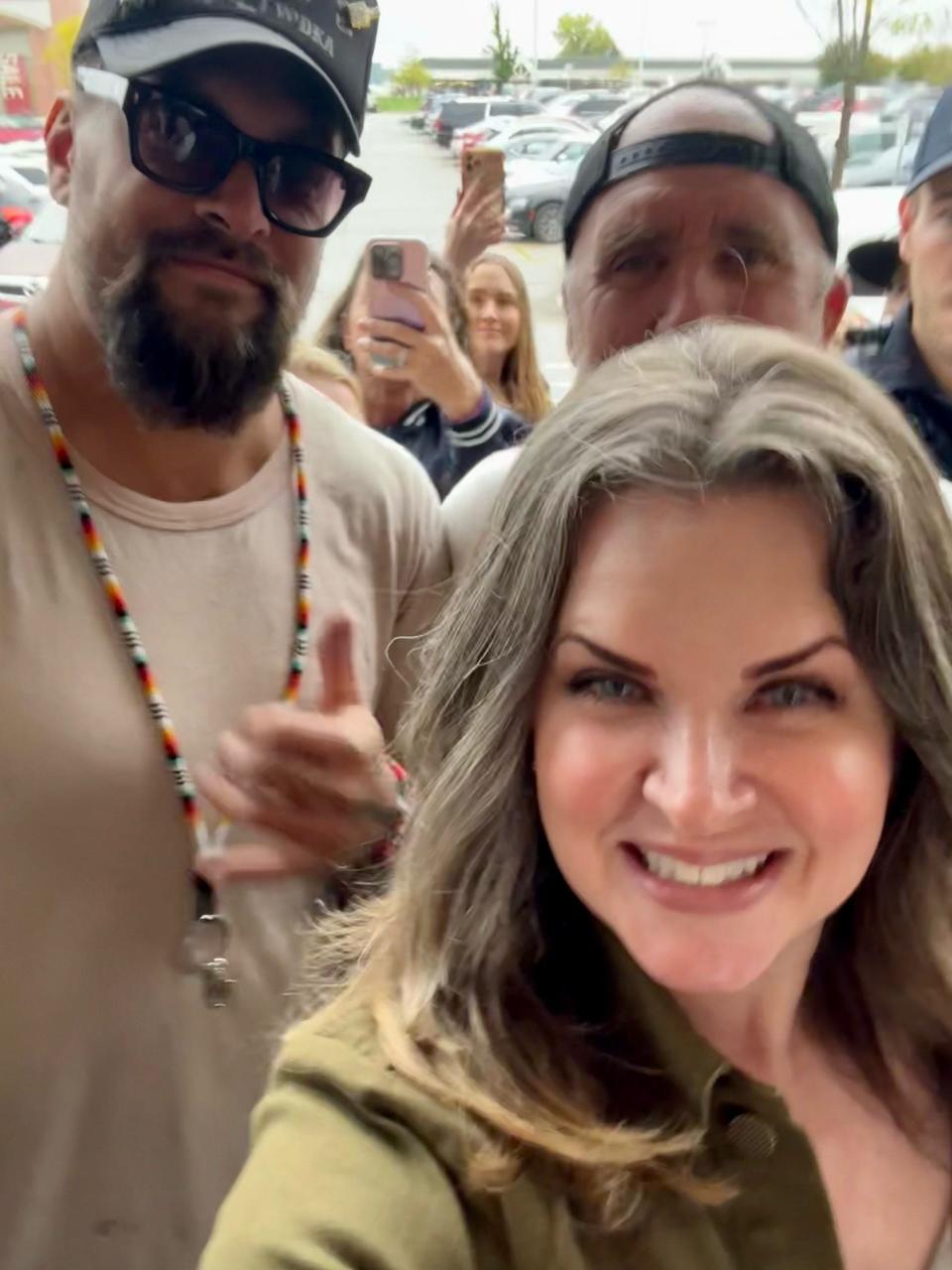 Chris Krasovich of Pewaukee takes a selfie with actor Jason Momoa outside Brookfield's Total Wine & More on Thursday. Momoa came to town to promote his new premium vodka brand, Meili, with co-founder and friend Blaine Halvorson.