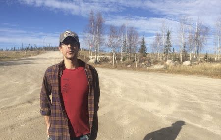 Green energy activist Daniel T'Seleie, who believes northern Canada could improve its energy security by investing in more solar panels, is pictured outside Bechoko, Northwest Territories in this September 30, 2015 file photo. REUTERS/Chris Arsenault/Thomson Reuters Foundation/Files