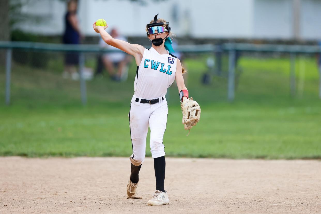 Craig Stinson doesn't want daughter Hailee - shown warming up prior to Tuesday's Little League Softball Rhode Island State Championship Game - to follow in his footsteps. He wants her to create her own.