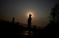<p>A soldier stands guard outside the Great Hall of the People, the venue of China’s National People’s Congress (NPC), in Beijing on March 9, 2018. (Photo: Jason Lee/Reuters) </p>