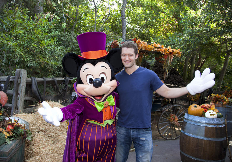 'Glee' star Matthew Morrison poses with a Halloween-themed Mickey Mouse on October 13, 2012 at Disneyland Park in Anaheim, California. In addition to celebrating Halloween at the park, Morrison also marked the visit with an early celebration of his October 30th birthday.  (Photo by Paul Hiffmeyer/Disney Parks via Getty Images)