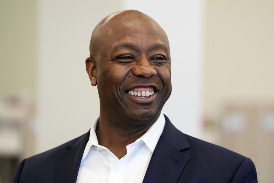 Sen. Tim Scott, R-S.C., tours the Marion Public Library, Wednesday, April 12, 2023, in Marion, Iowa. Scott on Wednesday launched an exploratory committee for a 2024 GOP presidential bid, a step that comes just shy of making his campaign official. (AP Photo/Charlie Neibergall)