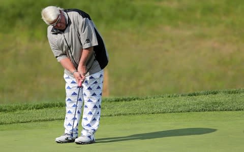 John Daly misses a putt on the fifth green during the second round of the PGA Championship golf tournament, - Credit: AP