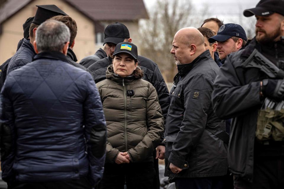 Ukraine's Prosecutor General Iryna Venediktova, center, visits a mass grave in Bucha, on the outskirts of Kyiv, on April 13, 2022, amid Russia's military invasion launched on Ukraine.