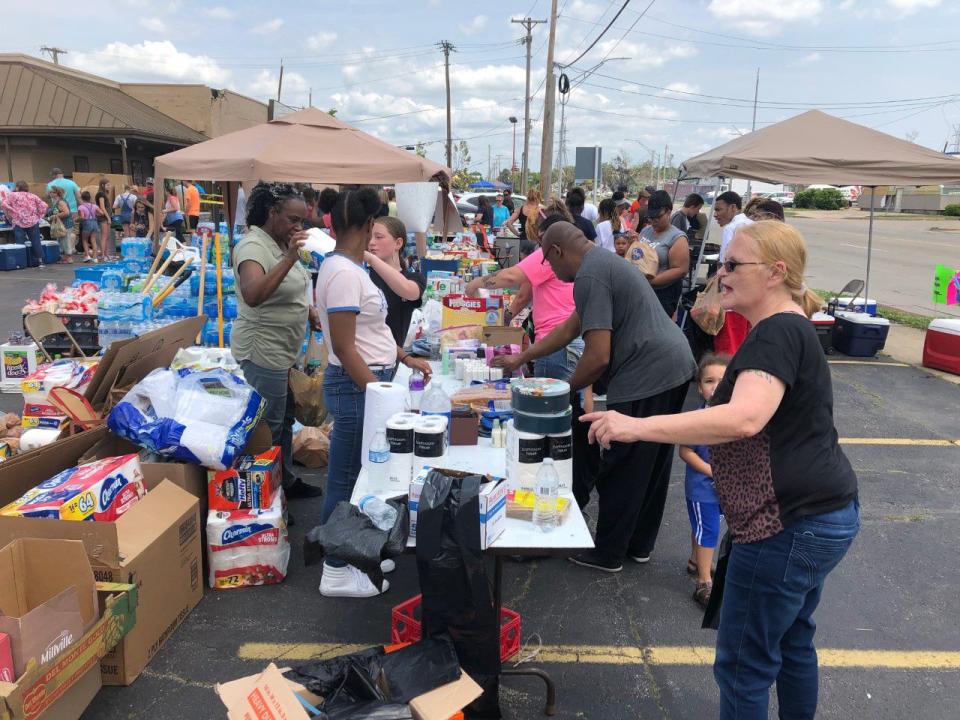 Volunteer tornado relief event in Old North Dayton. Volunteers gave out free food, water, and amenities at the corner of Old Troy Pike & Oberer Dr. for victims of the Memorial Day tornadoes. STAFF PHOTO / DREW TANNER