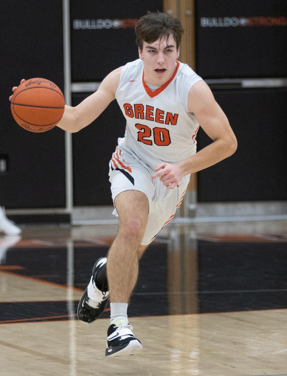 Green’s Brady Rollyson brings the ball down court against Hoover on Friday, Jan. 21, 2022.